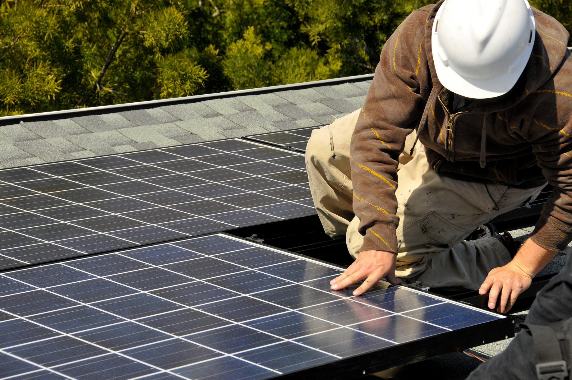 Solar Panel Installer on Residential Roof